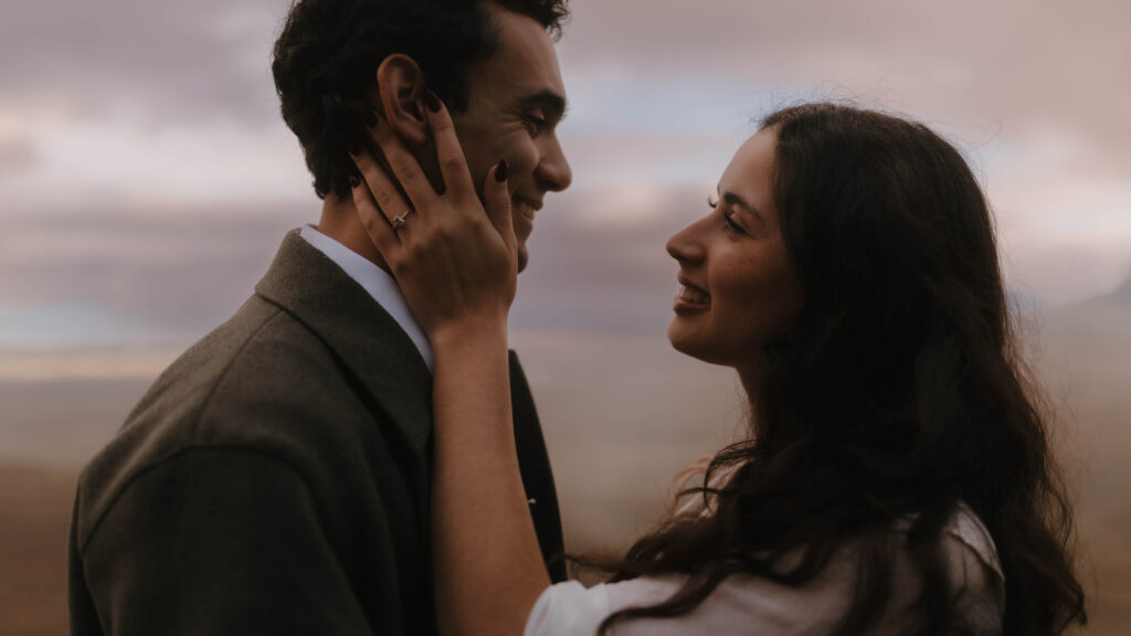 Romantic portrait of a couple during an Isle of Skye couples session, captured by Scotland fine art photographer Aly Robinson against soft Highland light.
