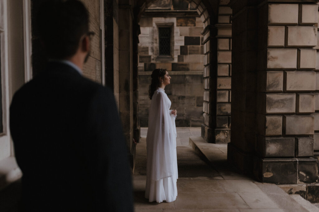 American couple cinematic engagement portrait Old Town Edinburgh