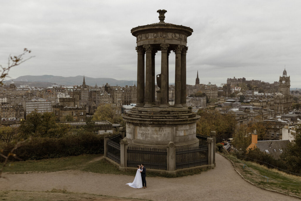 American couple cinematic engagement portrait Old Town Edinburgh