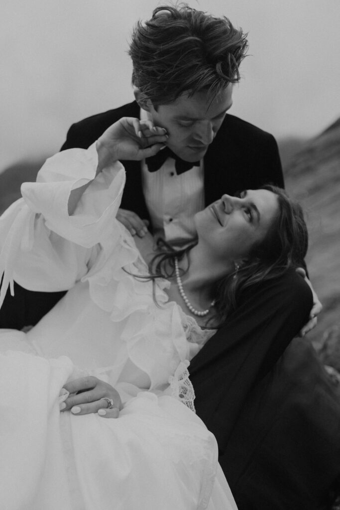 Cinematic close-up of a bride and groom during their Scotland elopement, photographed in a fine art, dark romantic style by a Highlands wedding photographer Aly Robinson.