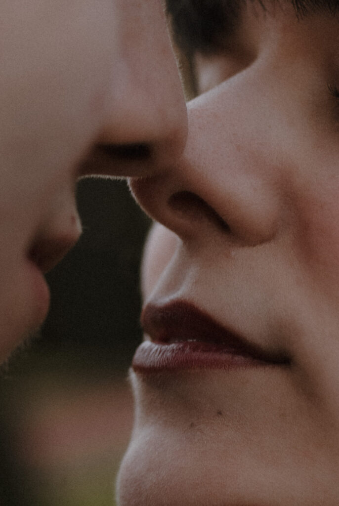 Close up of couple about to kiss during romantic elopement style portrait in the gardens of Prestonfield House Edinburgh wedding photography