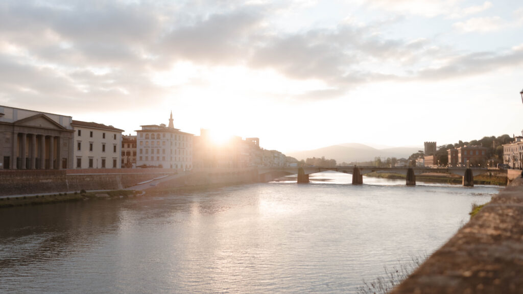 Cinematic sunset over the Arno River in Florence Italy, destination wedding photographer location scouting for luxury elopement photography