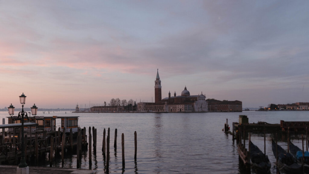 San Giorgio Maggiore at sunset in Venice Italy, cinematic destination wedding and elopement photographer capturing iconic Venice lagoon views
