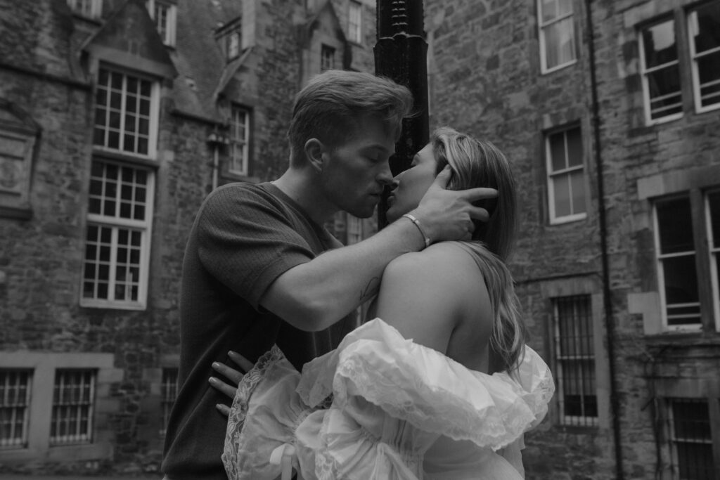 Luxury engagement photography in Edinburgh by Aly Robinson featuring intimate black and white close-up of couple kissing