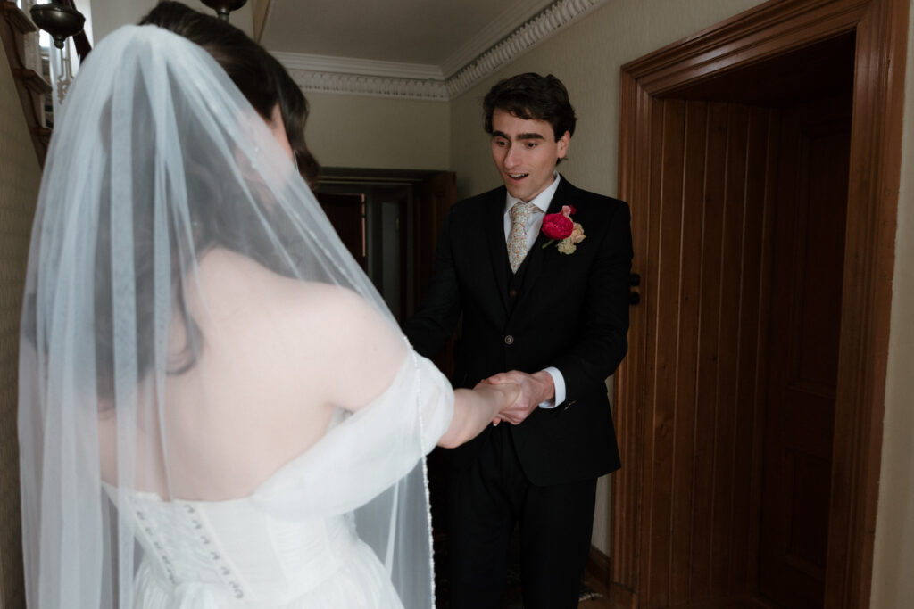 Bride and groom holding hands during a private first look at a Dalduff Farm wedding in Scotland