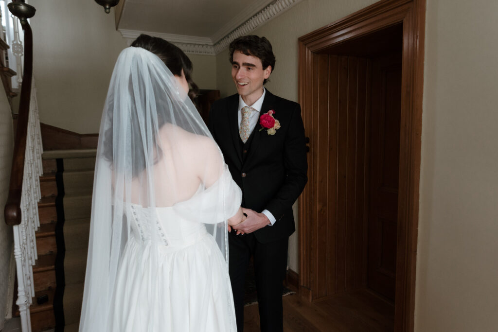 Emotional first look moment before an outdoor summer wedding ceremony at Dalduff Farm near Glasgow