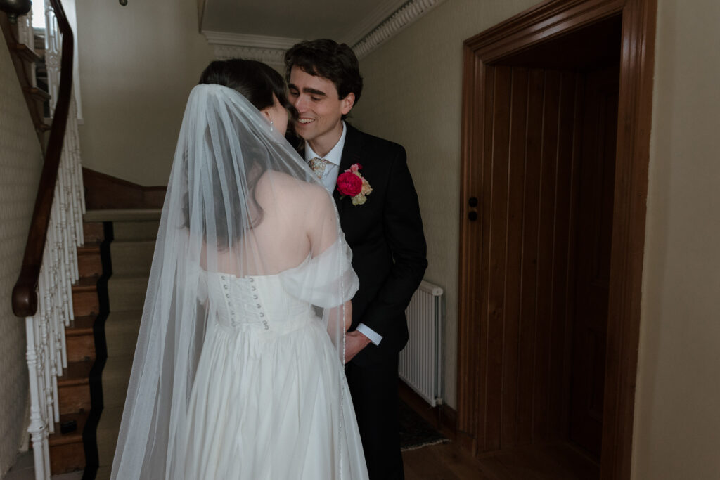 Cinematic Dalduff Farm wedding photography capturing a bride and groom smiling during their private first look