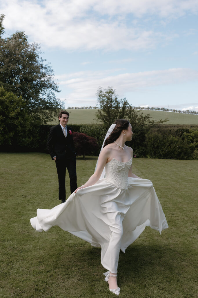 Movement-led couple portraits by a Dalduff Farm wedding photographer in the Scottish countryside